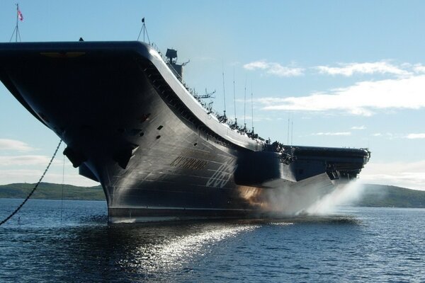 A 1968 military aircraft carrier against the sky