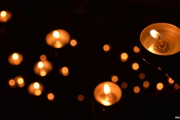 Burning candles in a notebook