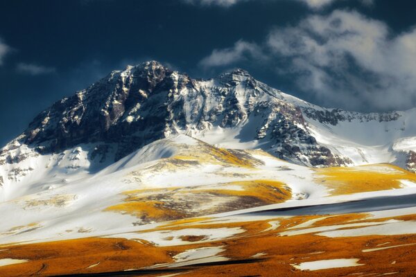 Mountain in the snow against the sky