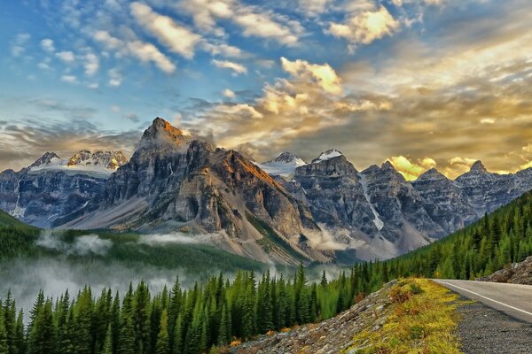 The mountains are covered with snow and fog