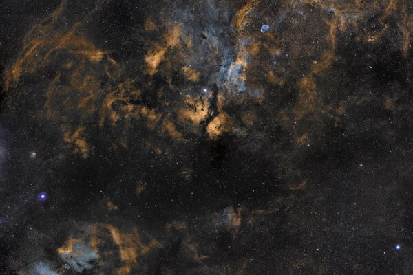 Abstraction of black smoke on a blue sky