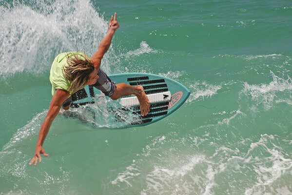 Surfer slides on wolves