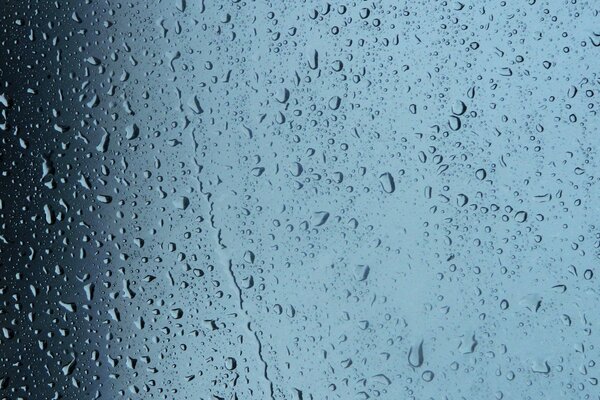 Fogged glass with small drops and drips