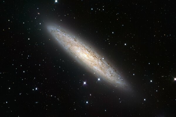 A galaxy against a background of black black space and stars