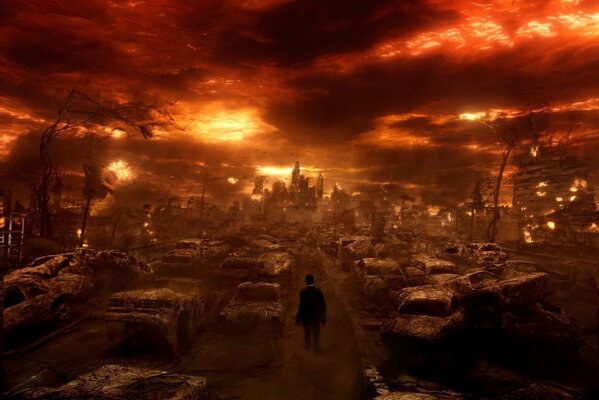 A man walking through a city burned by fire