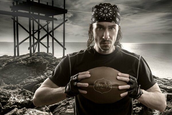 A man with a rugby ball in his hands
