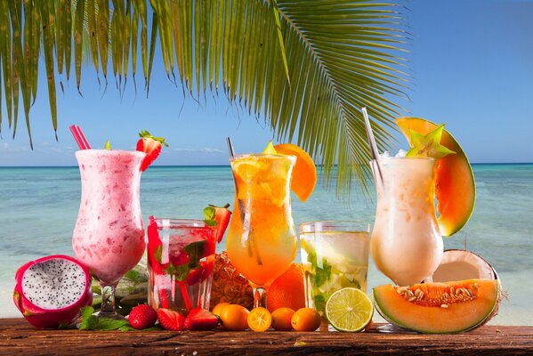 Sea, palm tree, cocktails, exotic fruits