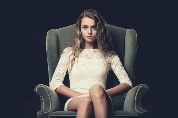 Portrait of a girl sitting in a chair