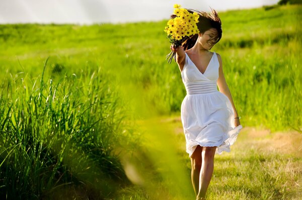 Smiling girl with yellow flowers