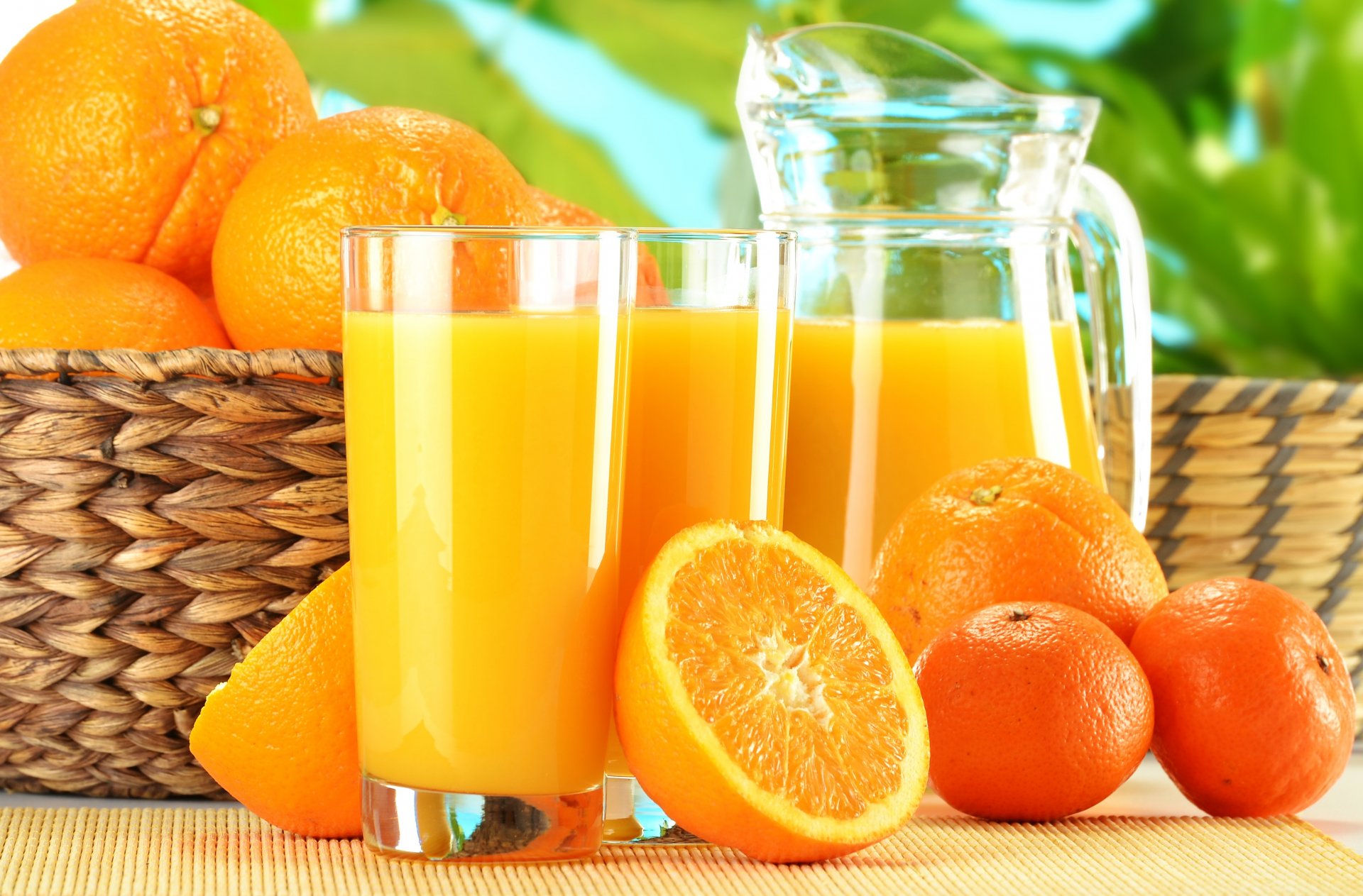 juice orange fruit oranges tangerines basket glasses jug