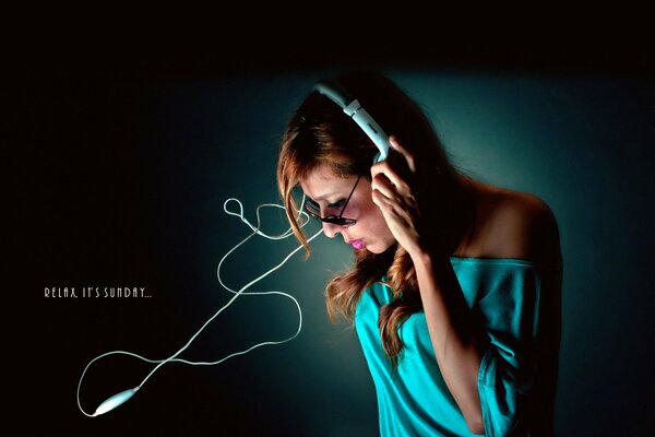 The girl in the headphones lowered her head