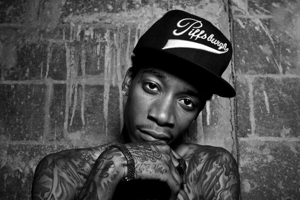 Rapper Cameron Jibril in a cap