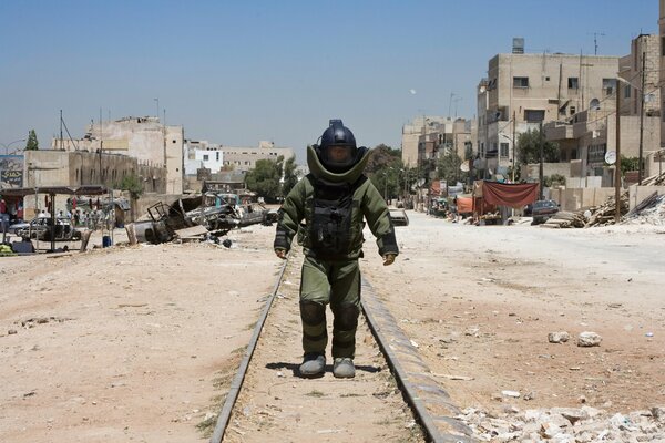 A shot from the movie Lord of the Storm a man walks in a protective suit