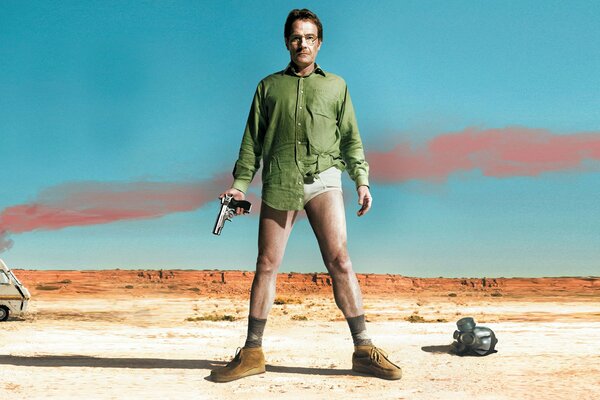 A man in a shirt and underpants with a gun