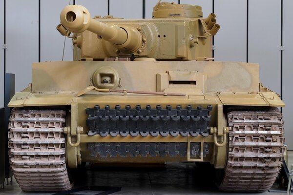 Camouflage-colored tank muzzle forward