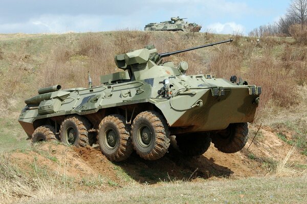Dirty BTR-82am on the field Russia