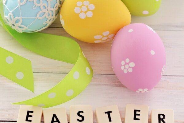 Easter card with the image of painted eggs and ribbons