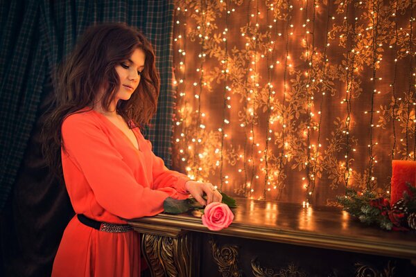 The girl in the red dress at the garlands