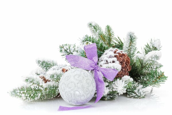 Christmas toy on a fir branch