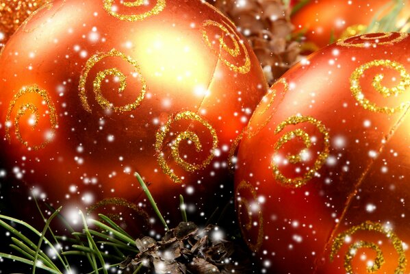Red Christmas balls with golden spirals