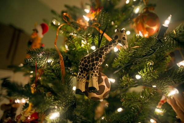 Christmas toys and garlands on the Christmas tree are burning