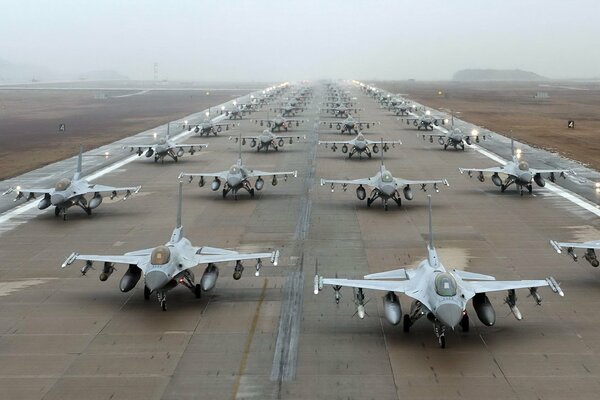 Military aircraft on the runway with weapons