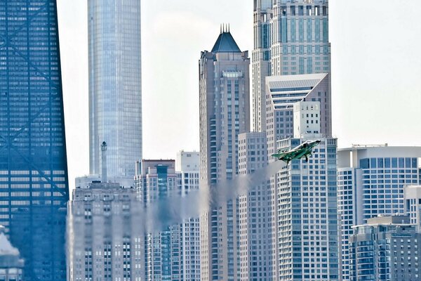 Inside the city, a fighter performs the wonders of aerobatics