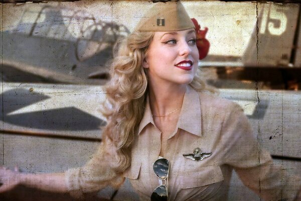 A girl in a pilot s uniform smiles