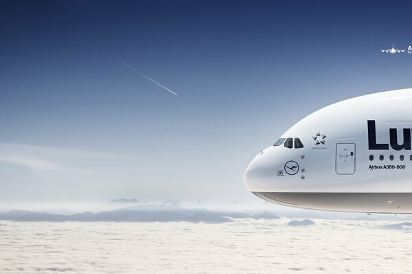The Boeing A 380 hovers above the clouds