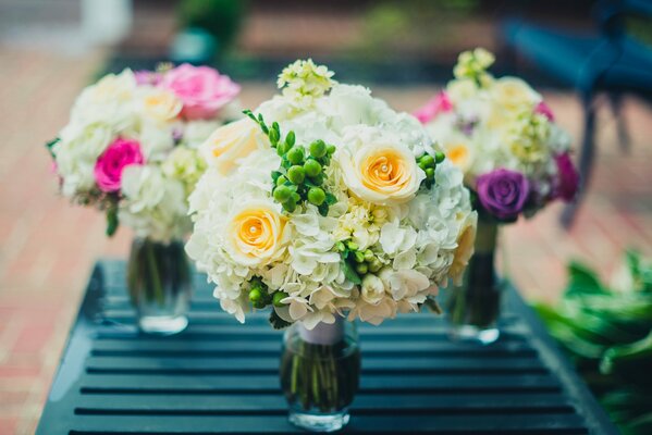 Stylish wedding bouquets in vases
