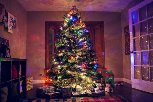 Christmas tree with Christmas lights in the room