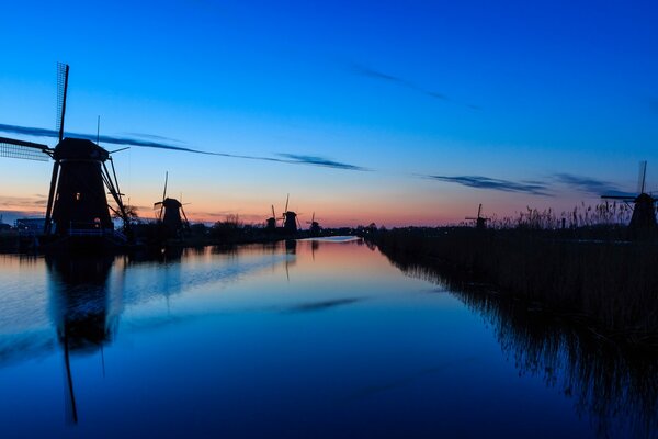 Evening river on the background of a colorful sunset