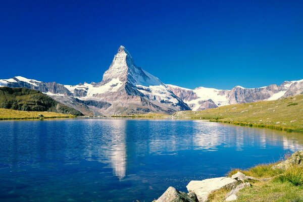 Spring peaks of the mountains near the lake