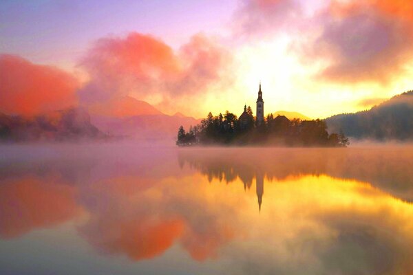 Castle in the fog, castle on the island, castle in the center of the lake on the island