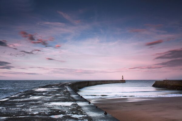 Sea pier lighthouse sunset