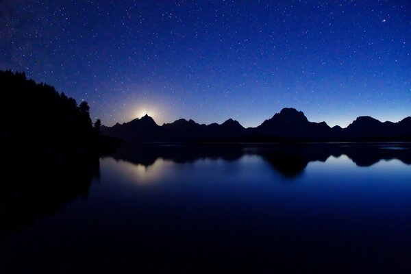 Moonlit night on the lake shore