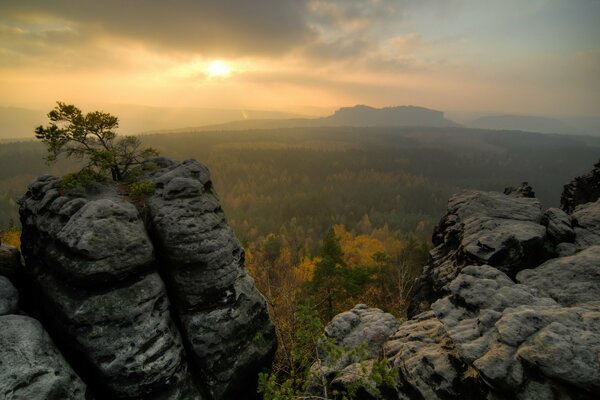 Autumn landscape with sunset and mountains