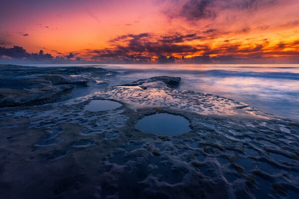 Rocky beach at sunset