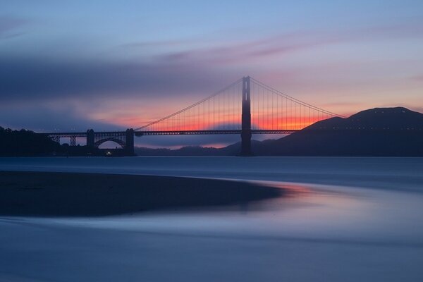Evening orange sunset on the Golden Gate Bridge in San Francisco